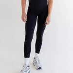 top-rated Rae Butter Collection black leggings from Raeya Fit. These best-selling leggings boast a 5-star rating and feature a 28" inseam to accommodate all heights, a Glute-Curve back seam to enhance the booty, and a sleek design with no front or side seams. The high-waisted leggings come with a double-lined hip band to ensure they stay in place during any activity. Made from exceptionally soft and comfortable fabric, these leggings are ideal for both workouts and everyday wear."