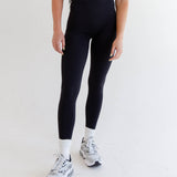 top-rated Rae Butter Collection black leggings from Raeya Fit. These best-selling leggings boast a 5-star rating and feature a 28" inseam to accommodate all heights, a Glute-Curve back seam to enhance the booty, and a sleek design with no front or side seams. The high-waisted leggings come with a double-lined hip band to ensure they stay in place during any activity. Made from exceptionally soft and comfortable fabric, these leggings are ideal for both workouts and everyday wear."