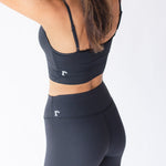 Raeya Fit's Waist Snatch leggings, ideal for women searching for comfy, affordable, and sustainable black leggings. These leggings boast a 25" inseam, ultra high-waisted fit, and a double-band design to flatten the stomach, with a rubber band to snatch the waist. Made from eco-friendly, post-consumer recycled fabric, these best-selling leggings provide a stylish and environmentally conscious option for everyday wear.